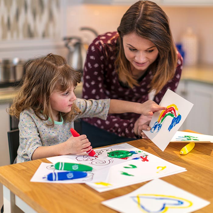 Child and parents being creative.