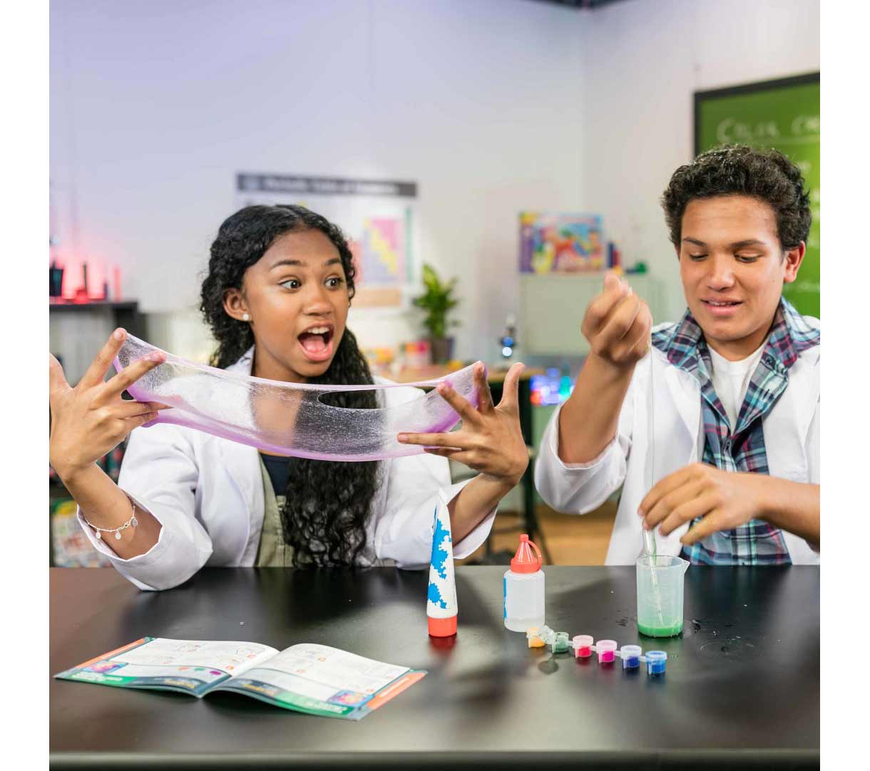 Crayola Glow Color Chemisty Set. Two people experimenting with glow slime.